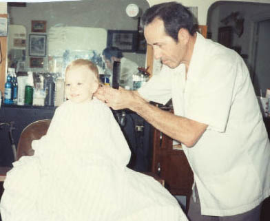 Mike Collins cutting Dustin's hair